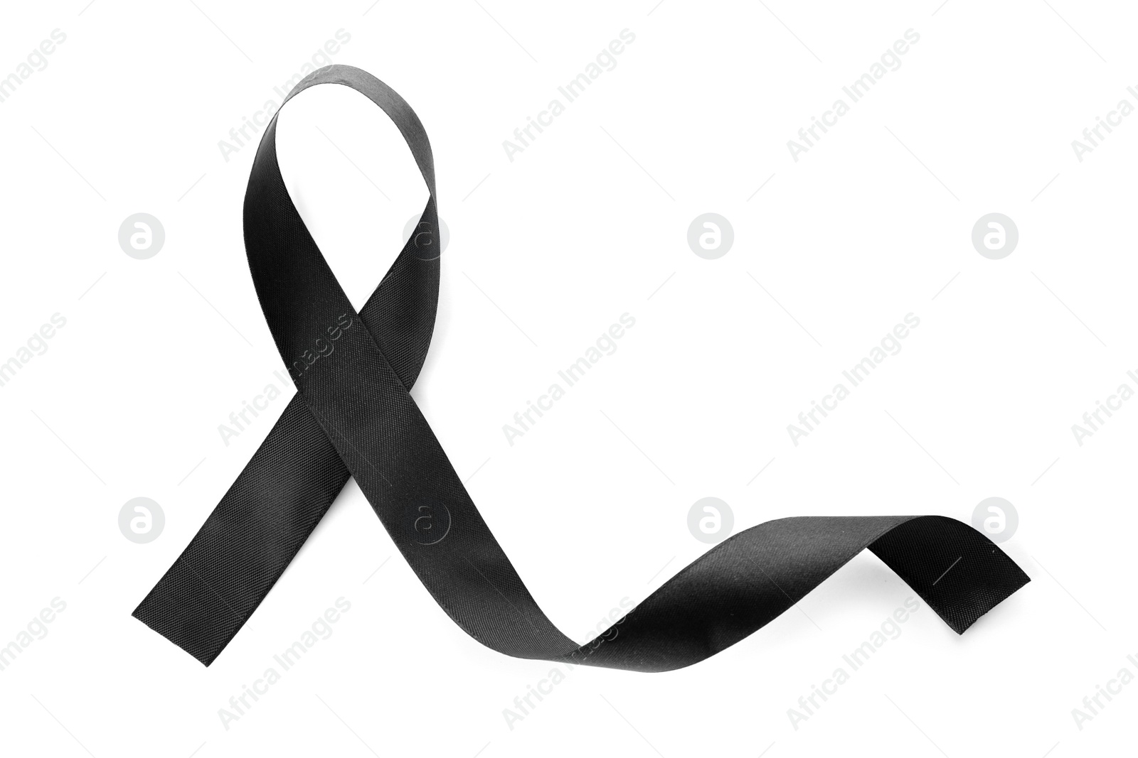 Photo of Black ribbon on white background, top view. Funeral symbol