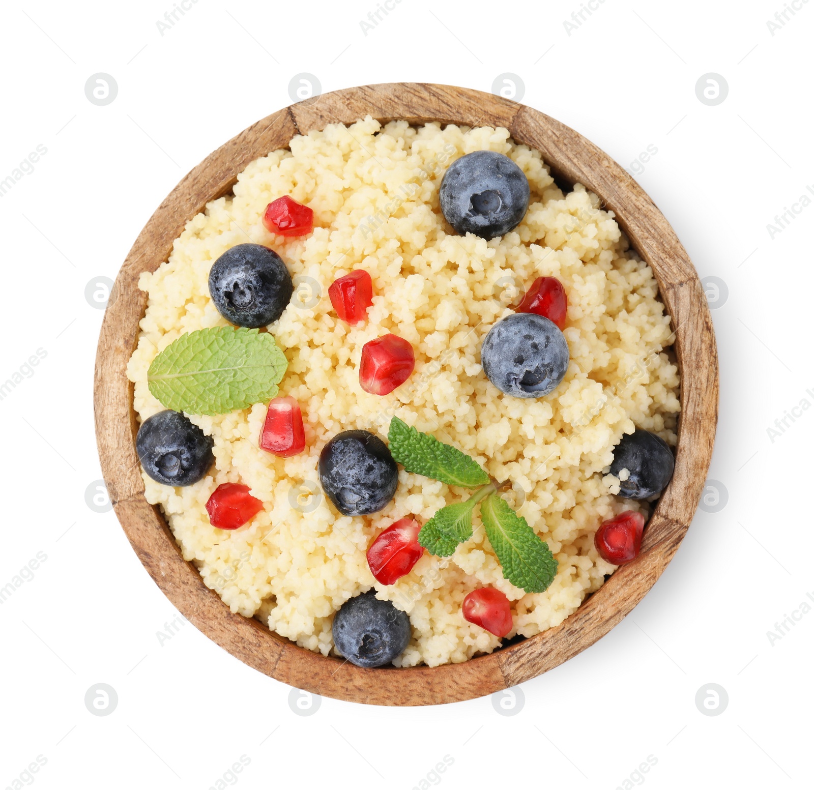 Photo of Bowl of tasty couscous with blueberries, pomegranate and mint isolated on white, top view