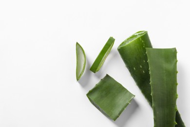 Cut aloe vera plant on white background, flat lay. Space for text