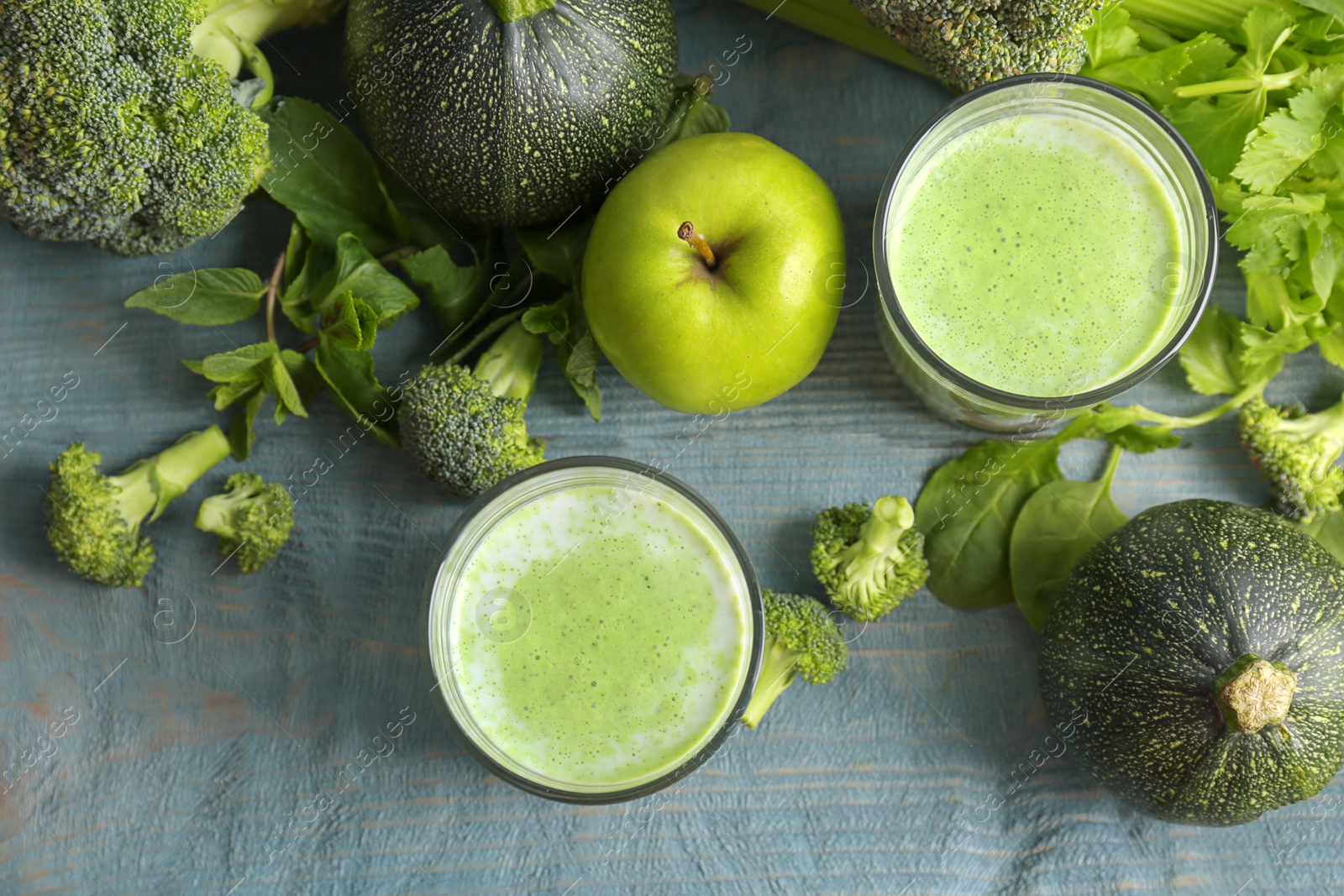 Photo of Flat lay composition with healthy detox smoothie and ingredients on wooden background