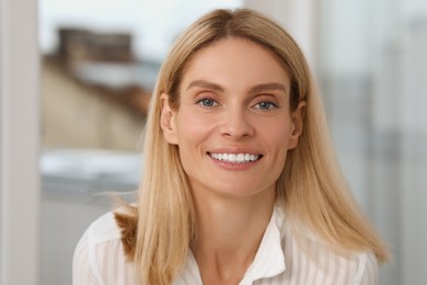 Photo of Portrait of confident entrepreneur or businesswoman. Beautiful lady with blonde hair smiling and looking into camera