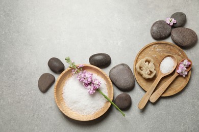 Photo of Flat lay composition with sea salt and spa stones on grey marble table