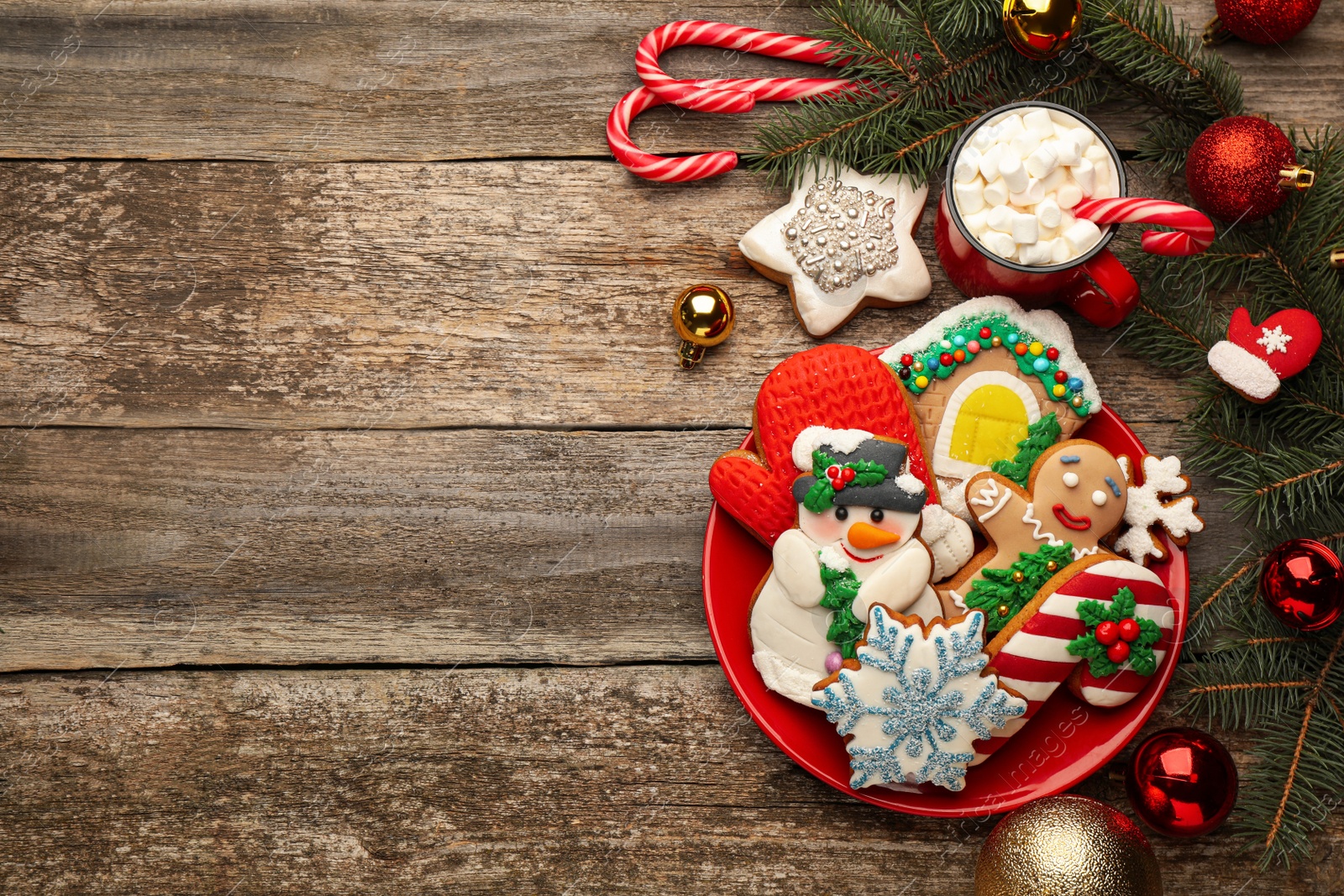 Photo of Delicious homemade Christmas cookies, cocoa and festive decor on wooden table, flat lay. Space for text