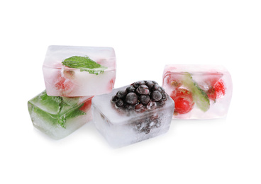 Ice cubes with berries and mint on white background
