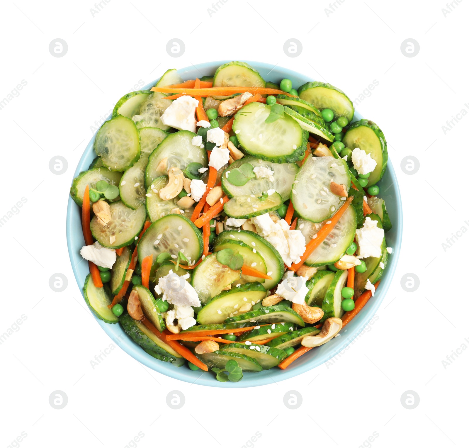 Photo of Bowl of delicious cucumber salad isolated on white, top view