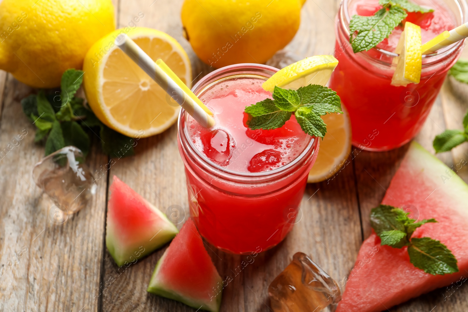 Photo of Delicious fresh watermelon drink on wooden table