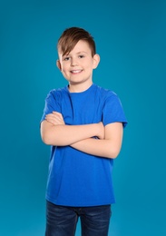 Portrait of little boy on color background
