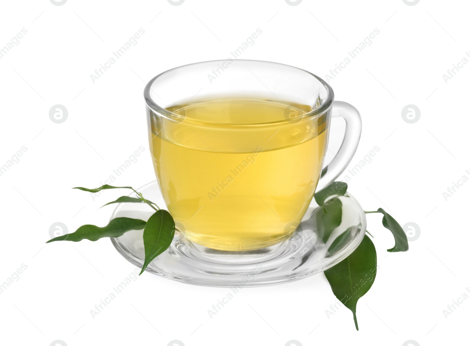 Photo of Fresh green tea in glass cup, leaves and saucer isolated on white