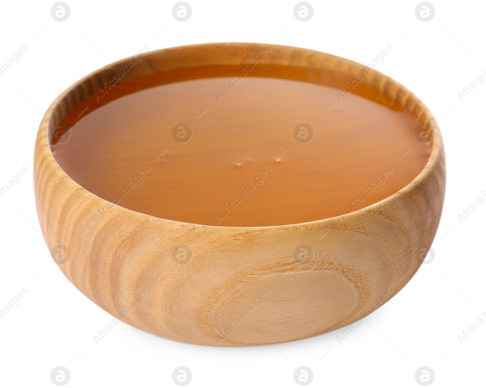 Photo of Tasty honey in bowl isolated on white