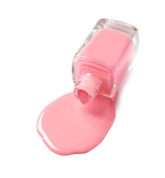 Spilled color nail polish with bottle on white background