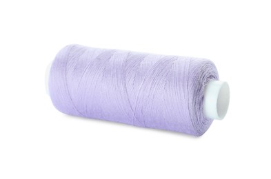 Photo of Spool of violet sewing thread isolated on white