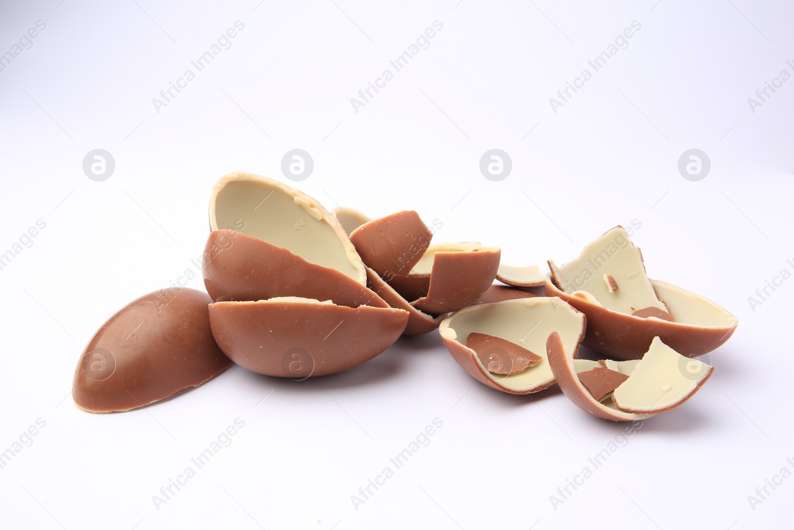 Photo of Sveti Vlas, Bulgaria - July 3, 2023: Broken halves of Kinder Surprise Eggs isolated on white