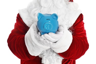 Santa Claus holding piggy bank on white background, closeup