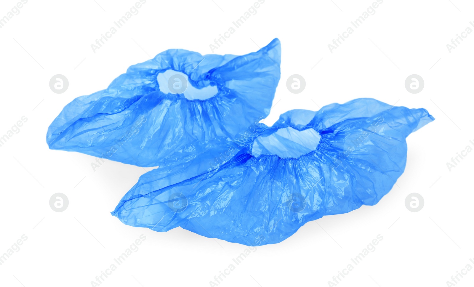 Photo of Pair of blue medical shoe covers isolated on white