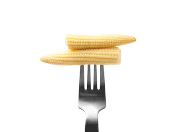 Photo of Pickled baby corn on fork isolated on white