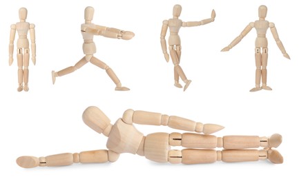 Image of Set with wooden human models in different poses on white background