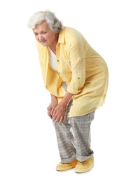 Full length portrait of senior woman having knee problems on white background