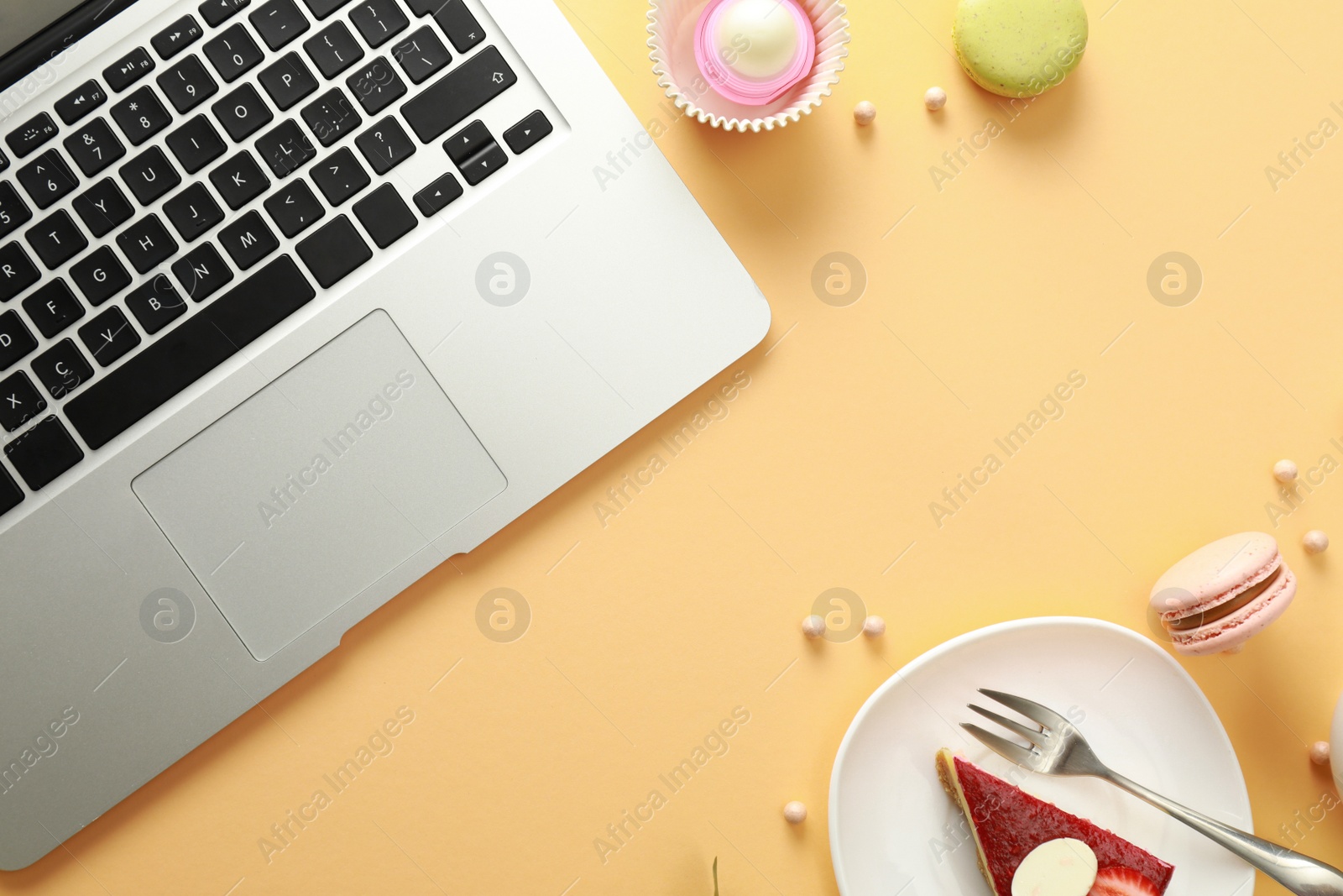 Photo of Flat lay composition with laptop on beige background. Food blogger's workplace