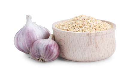 Photo of Dehydrated garlic granules in bowl and fresh bulbs isolated on white