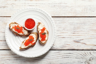 Photo of Sandwiches with red caviar on plate