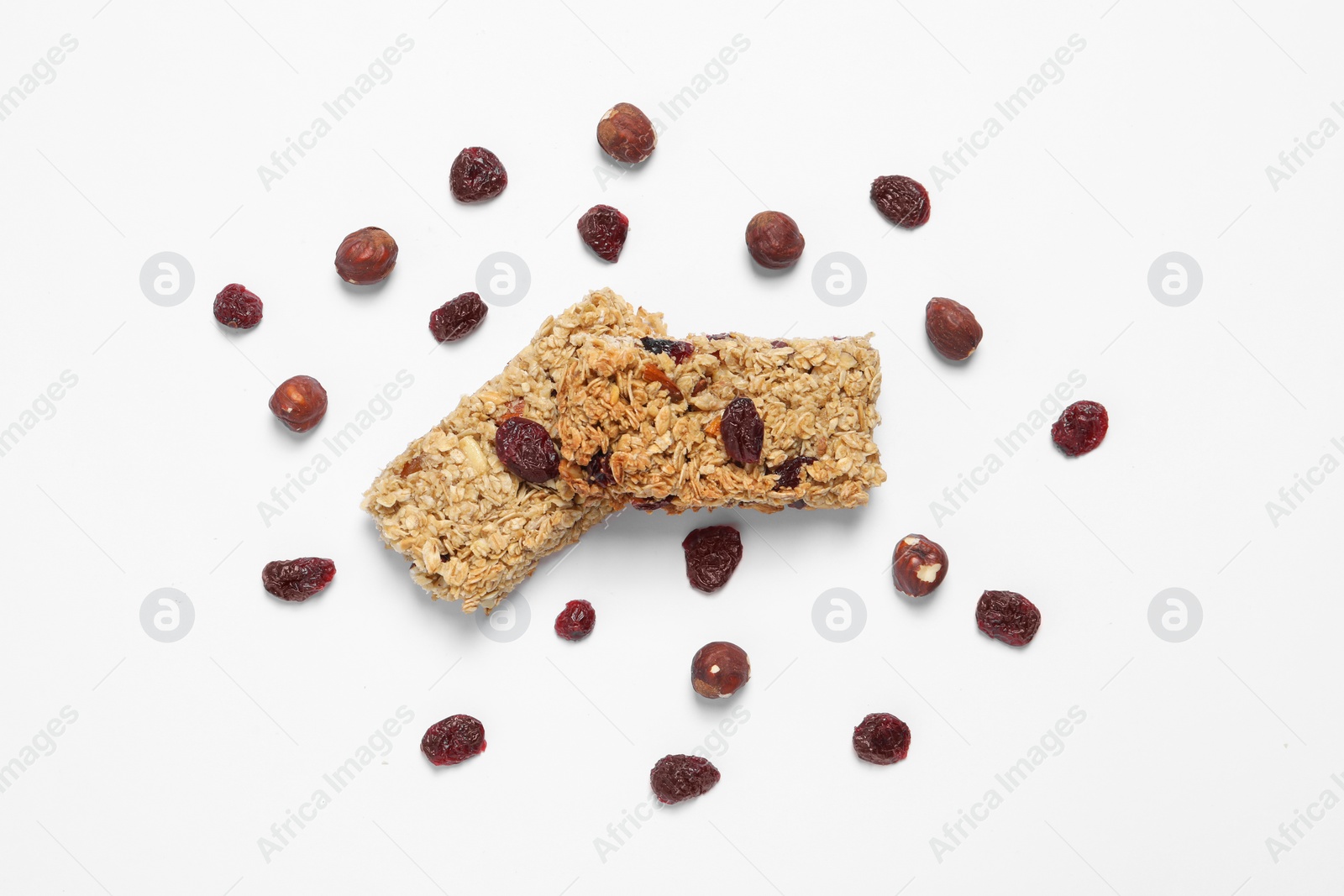Photo of Tasty granola bars with dry cherries and nuts on white background, flat lay