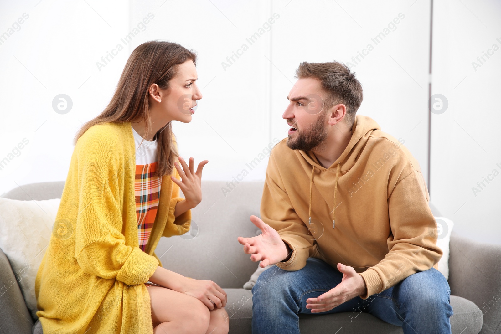 Photo of Couple having quarrel at home. Relationship problems