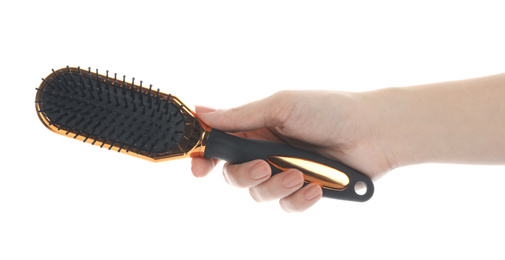 Woman holding modern hair brush on white background, closeup