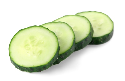 Photo of Slices of fresh cucumber on white background