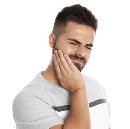 Photo of Man suffering from acute toothache on white background