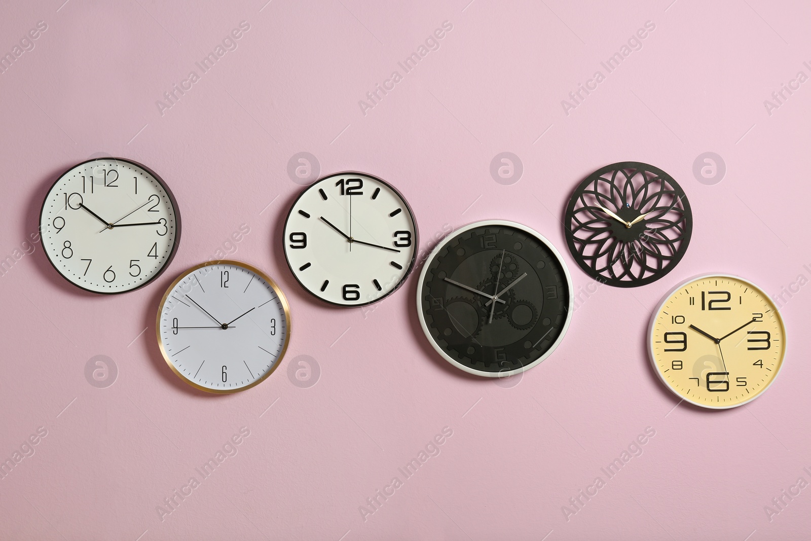 Photo of Different clocks on color background. Time management