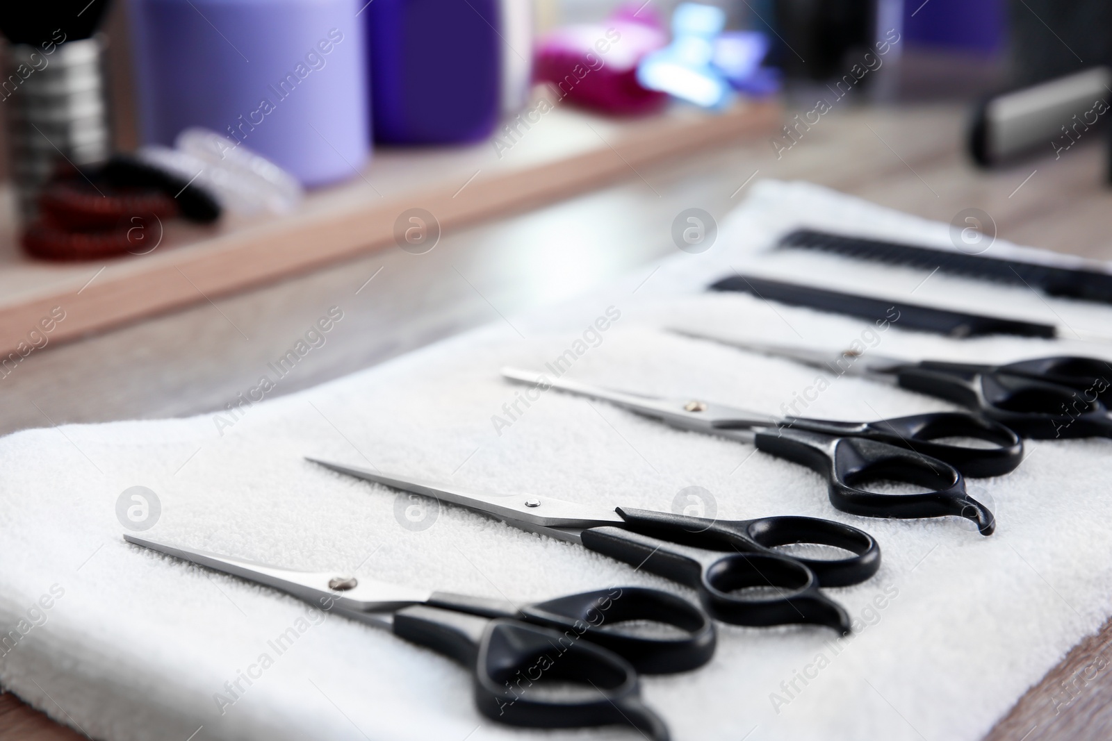 Photo of Different scissors at hairdresser's workplace