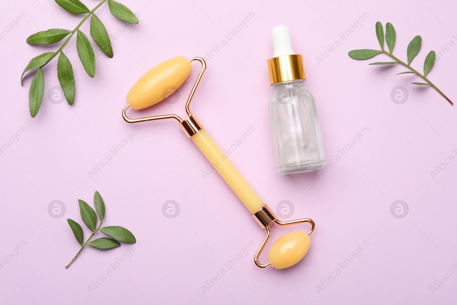 Photo of Natural face roller, cosmetic product and leaves on pink background, flat lay