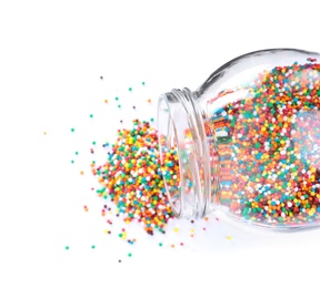 Photo of Colorful sprinkles in jar on white background, top view. Confectionery decor