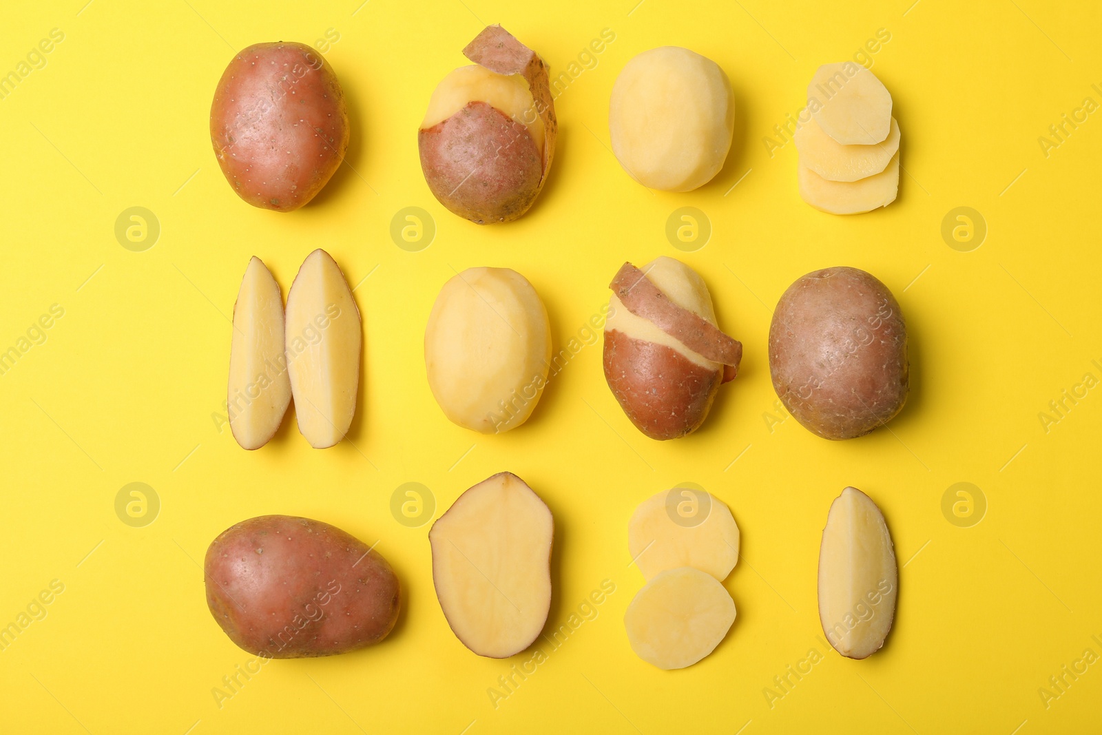 Photo of Flat lay composition with fresh organic potatoes on color background