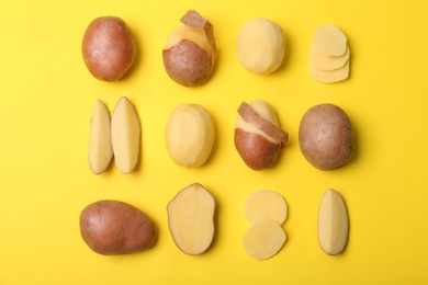 Flat lay composition with fresh organic potatoes on color background