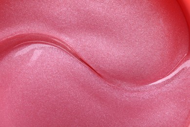 Photo of Shiny pink under eye patches as background, closeup. Cosmetic product