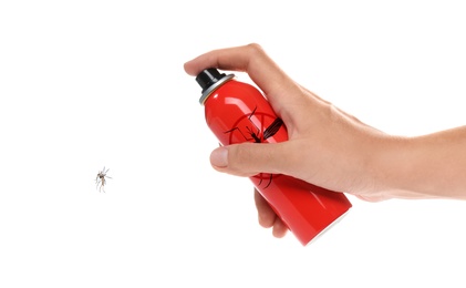 Woman spraying insect repellent on mosquito against white background, closeup