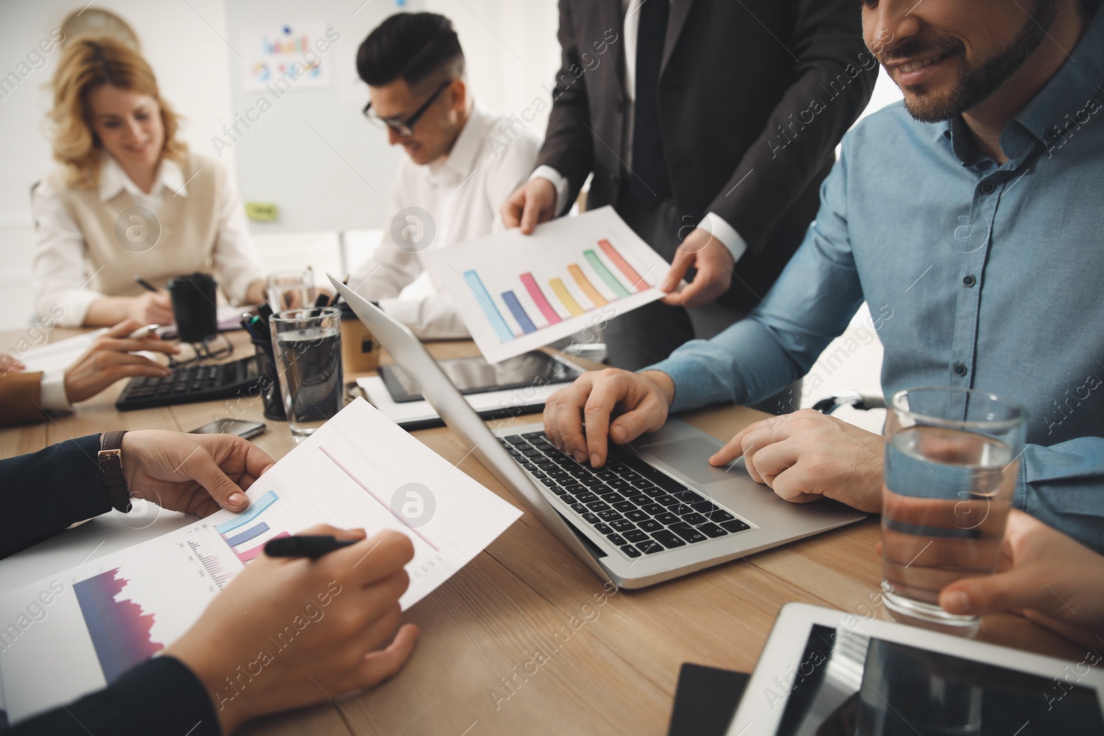 Photo of Businesspeople having meeting in office, closeup. Management consulting