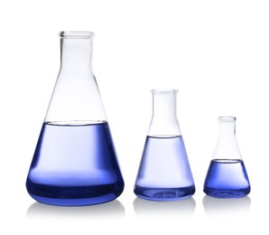 Image of Conical flasks with blue liquid isolated on white. Laboratory glassware