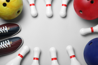 Photo of Composition with bowling balls, shoes and pins on white background, flat lay. Space for text