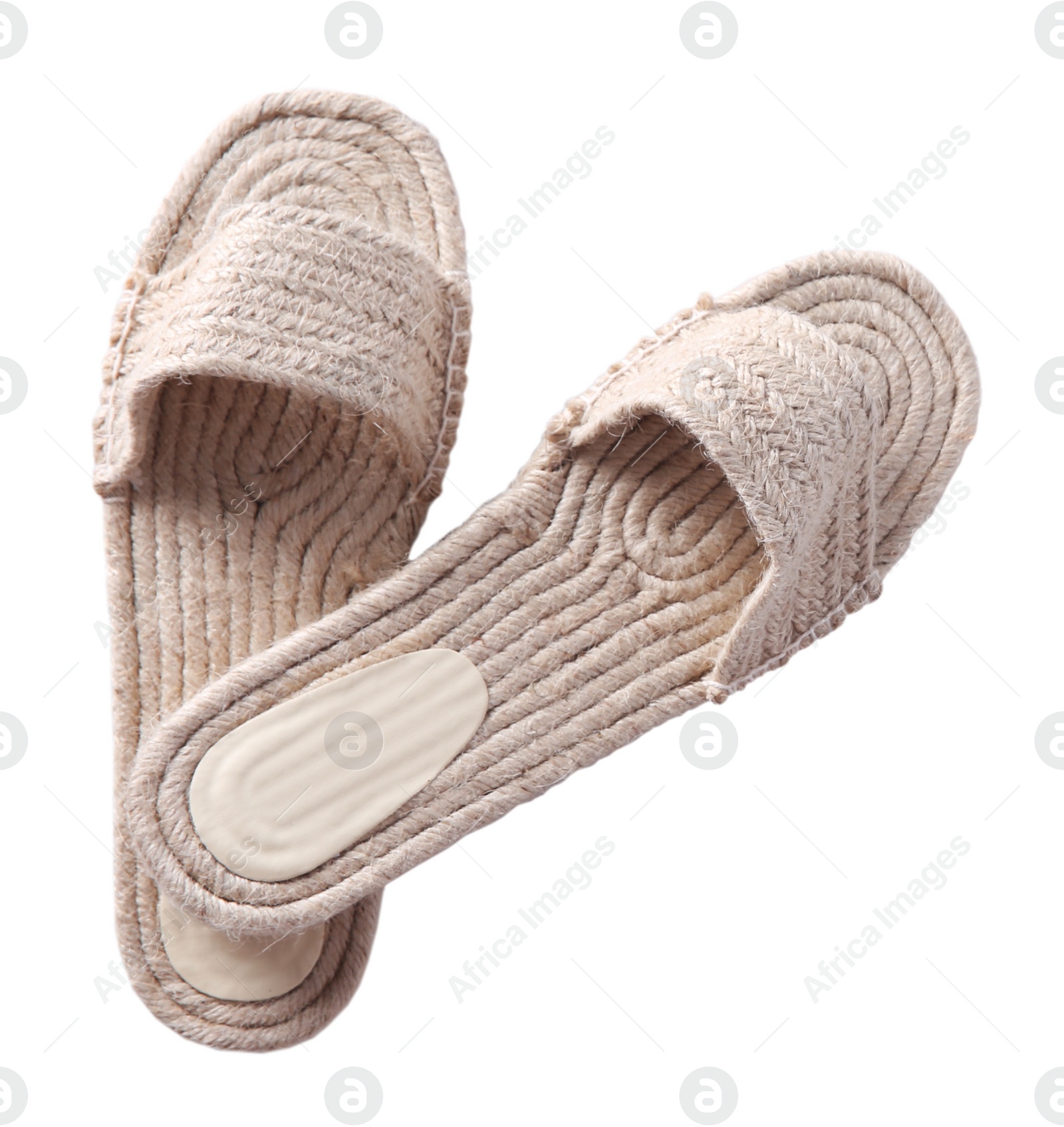 Photo of Stylish knitted shoes isolated on white, top view. Beach accessory