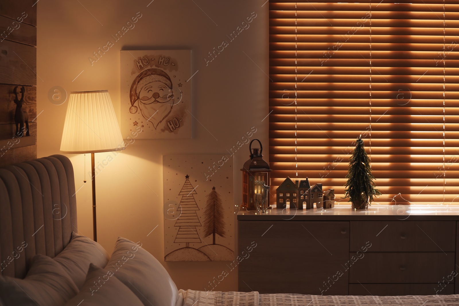 Photo of Beautiful Christmas pictures in decorated room. Interior design