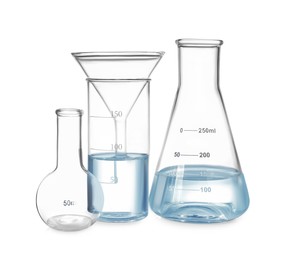 Different laboratory glassware with water isolated on white