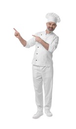 Photo of Happy chef in uniform pointing at something on white background