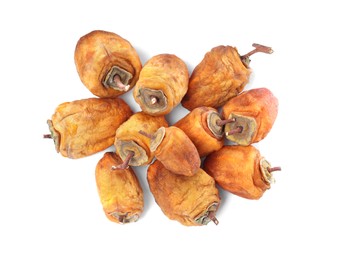 Tasty dried persimmon fruits on white background, top view