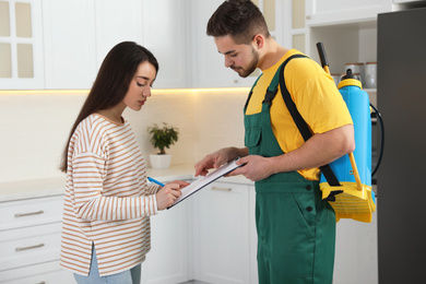 Woman signing documents at home. Pest control service