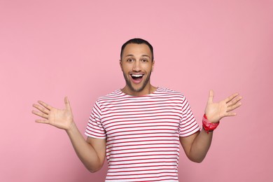 Photo of Portrait of emotional African American man on pink background