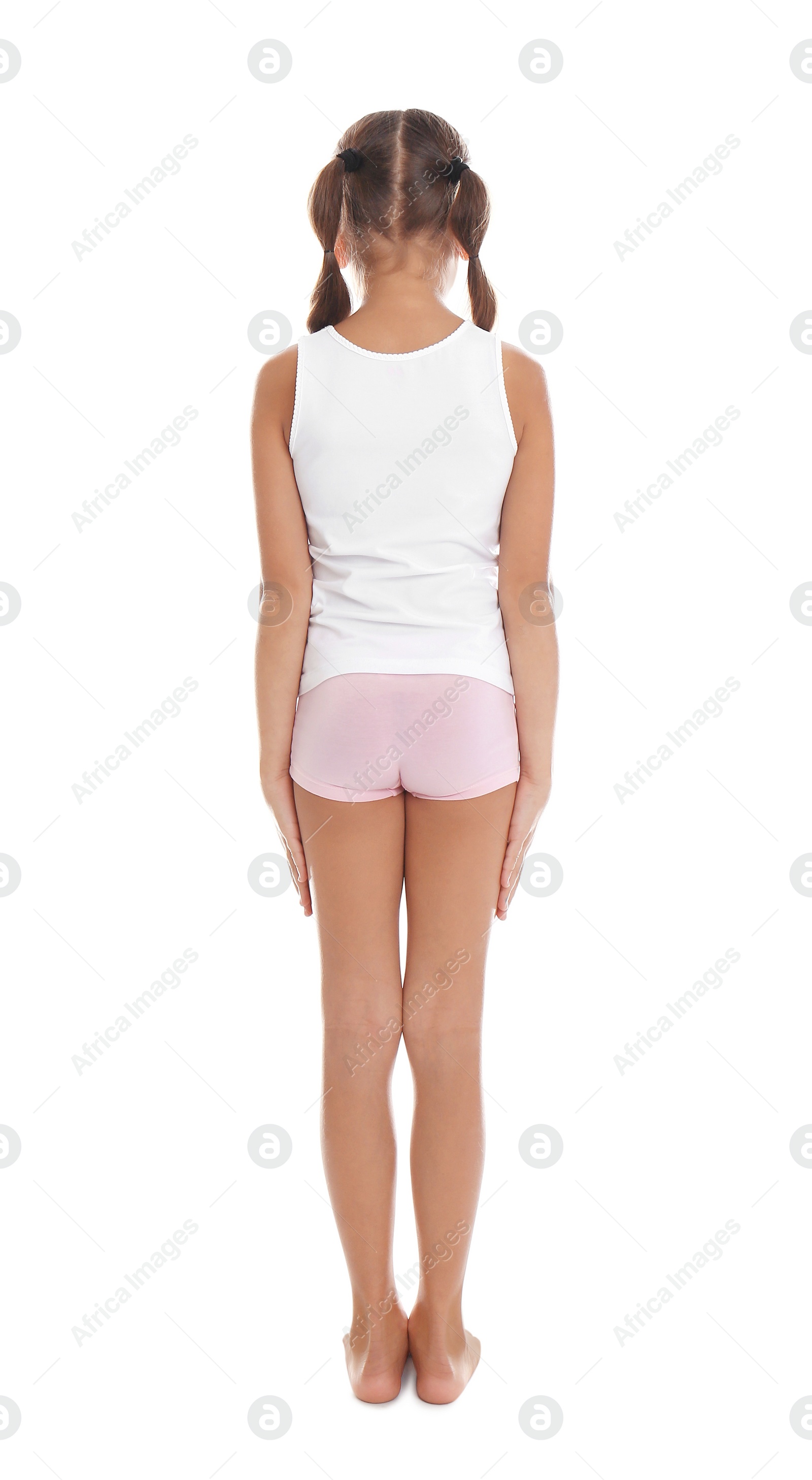 Photo of Little girl in underwear on white background, back view