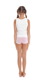 Little girl in underwear on white background, back view