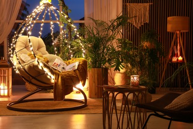 Indoor terrace interior with comfortable hanging chair and houseplants